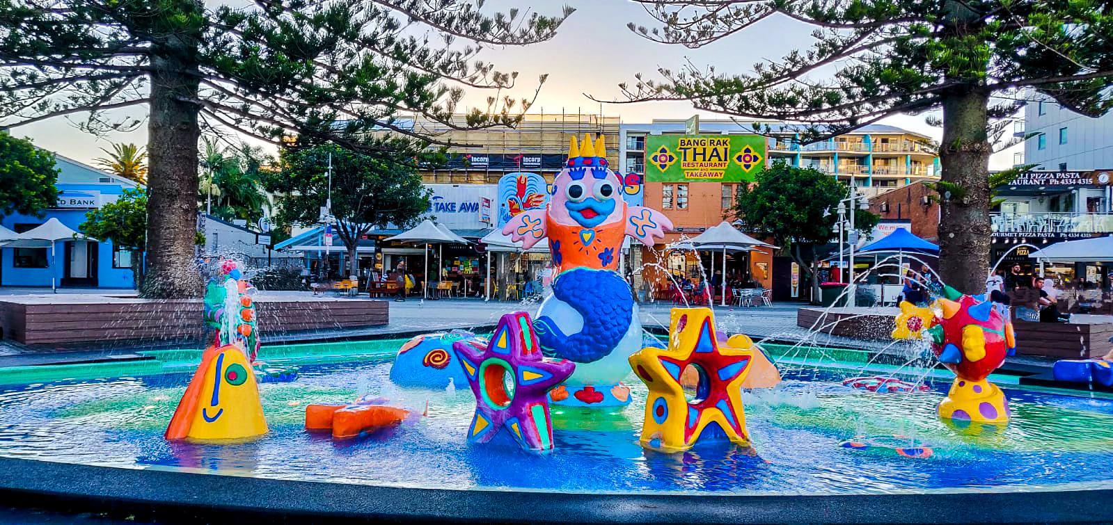 Kids play fountain and the playground at The Entrance